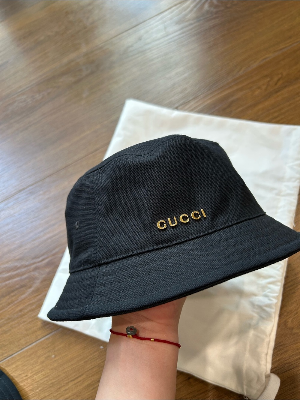 Gucci Black Bucket Hat with Gold Logo
